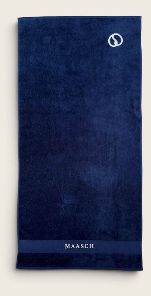 MAASCH towel in navy, laid out